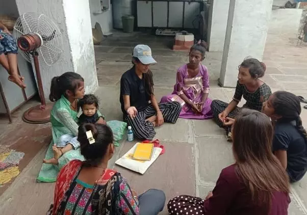 Kishor Mitra sharing adolescent health related knowledge with her peers.