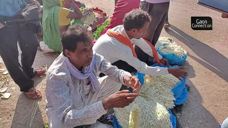 Farmers selling jasmine flowers at Varanasis flower market. Photo by Ankit Rathore