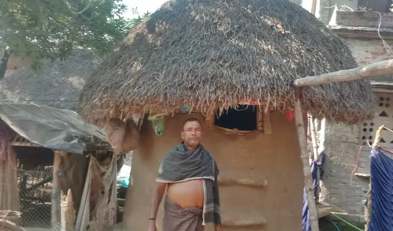 Sambhu Ray from Kharinashi village regularly repairs the gola where he stores paddy.