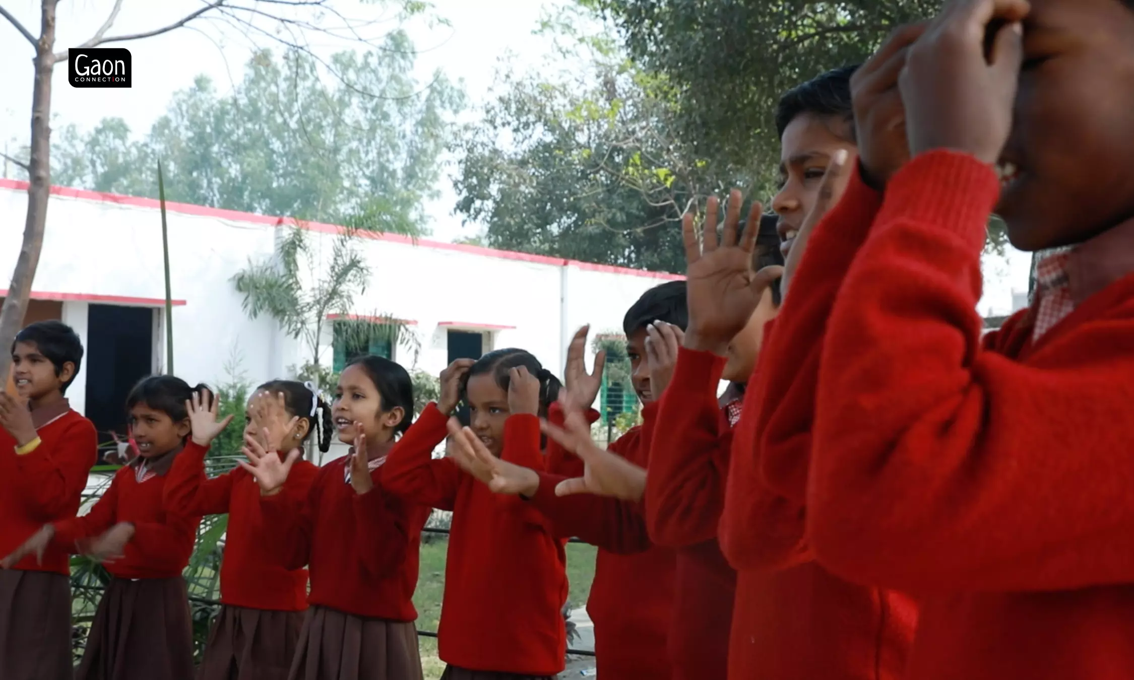 On a breezy morning, a group of third graders huddle underneath a Peepal tree, at the Siktaur primary school.