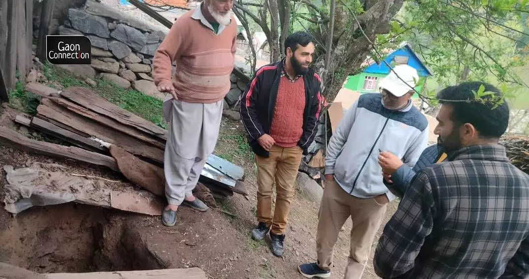 Officials from the local Krishi Vigyan Kendra overseeing the preservation of potatoes.