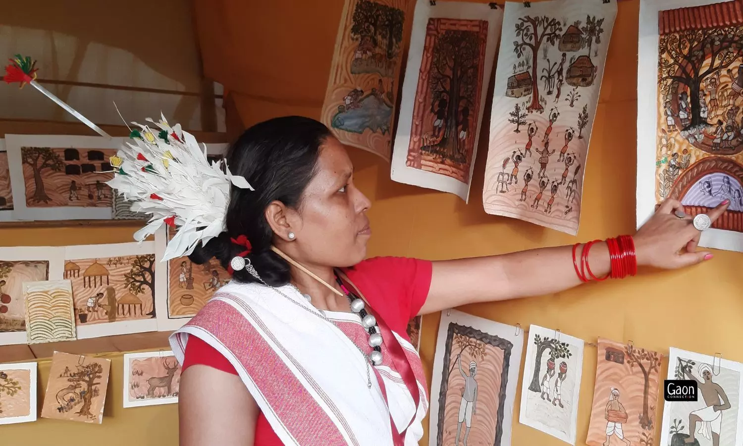 A big part of the colours in an Oraon painting come out of soil of different colours. Tribal artists dilute the red, brown and red soil in water and use that as paint.